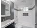 Modern bathroom with tiled walls, updated fixtures, new vanity and natural light at 1141 Temperance Ave, Indianapolis, IN 46203