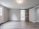 Bedroom boasts an ensuite bathroom with modern sliding door and ample natural light at 1141 Temperance Ave, Indianapolis, IN 46203
