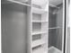 Organized walk-in closet with built-in shelving and ample storage space at 1141 Temperance Ave, Indianapolis, IN 46203