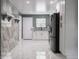 Bright kitchen features updated countertops, stainless steel appliances, and tile flooring at 1141 Temperance Ave, Indianapolis, IN 46203