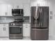 Well-equipped kitchen features modern appliances, granite counters, and ample cabinet space at 1141 Temperance Ave, Indianapolis, IN 46203