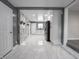 Bright kitchen with modern appliances, white cabinets, and tiled floors at 1141 Temperance Ave, Indianapolis, IN 46203