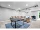 Finished basement features neutral colors, carpet flooring, a couch and a TV at 11956 Glen Cove Dr, Indianapolis, IN 46236