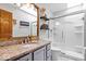 Bathroom features a tiled shower, skylight, granite counters, and wood accents at 11956 Glen Cove Dr, Indianapolis, IN 46236