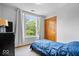 Cozy bedroom offers a large window with backyard views and a wood closet at 11956 Glen Cove Dr, Indianapolis, IN 46236