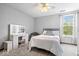 This bedroom has carpet floors, a ceiling fan, and a makeup vanity with mirror at 11956 Glen Cove Dr, Indianapolis, IN 46236
