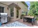 Outdoor deck furnished with a grill and dining set, perfect for al fresco meals and gatherings at 11956 Glen Cove Dr, Indianapolis, IN 46236