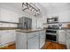 Modern kitchen with stainless steel appliances, granite countertops, and a center island at 11956 Glen Cove Dr, Indianapolis, IN 46236