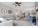 Open-concept living area with modern furnishings, natural light, and seamless flow to kitchen at 11956 Glen Cove Dr, Indianapolis, IN 46236