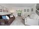 Cozy living room with plush carpeting, comfortable seating, and bright natural light at 11956 Glen Cove Dr, Indianapolis, IN 46236