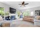 Bright living room with large windows, fireplace, and comfortable seating arrangements at 11956 Glen Cove Dr, Indianapolis, IN 46236