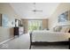 Large main bedroom with neutral walls, a ceiling fan, and a bay window at 11956 Glen Cove Dr, Indianapolis, IN 46236