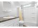 Clean bathroom with white vanity, tub/shower combo, and modern fixtures at 12277 E Harvest Glen Dr, Indianapolis, IN 46229