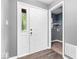 Bright entryway with white doors, wood flooring, and gray painted walls at 12277 E Harvest Glen Dr, Indianapolis, IN 46229