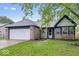 Charming single-Gathering home featuring a 2-car garage and a well-maintained lawn at 12277 E Harvest Glen Dr, Indianapolis, IN 46229