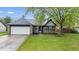 Charming single-Gathering home featuring a 2-car garage and a well-maintained lawn at 12277 E Harvest Glen Dr, Indianapolis, IN 46229