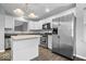 Well-lit kitchen featuring stainless steel appliances, granite countertops and center island at 12277 E Harvest Glen Dr, Indianapolis, IN 46229