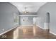Bright living room features vaulted ceiling, ceiling fan, and wood floors at 12277 E Harvest Glen Dr, Indianapolis, IN 46229