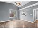 Bright living room features vaulted ceiling, wood floors, and a view to the kitchen at 12277 E Harvest Glen Dr, Indianapolis, IN 46229