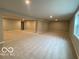Expansive basement with neutral carpeting, recessed lighting, and a blank canvas for customization at 12511 Lowery Way, Fishers, IN 46037