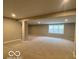 Large finished basement with a window and neutral paint, offering flexible space for various uses at 12511 Lowery Way, Fishers, IN 46037