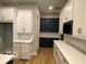 Contemporary kitchen featuring white and blue cabinets, stainless steel appliances, and stylish subway tile at 12511 Lowery Way, Fishers, IN 46037