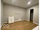 Well-lit laundry room with utility sink and shelving for efficient organization and convenience at 12511 Lowery Way, Fishers, IN 46037