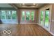 Spacious living area features beautiful windows and a glass door, seamlessly connecting indoor and outdoor spaces at 12511 Lowery Way, Fishers, IN 46037