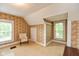 Bedroom with carpet, sloped ceilings, vintage wallpaper and three windows at 126 N Darlington St, Jamestown, IN 46147