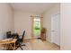 Clean bedroom with a large window, neutral carpet, and a small desk and chair at 126 N Darlington St, Jamestown, IN 46147
