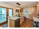Bright kitchen featuring granite countertops, a stylish island with seating, and modern light fixtures at 126 N Darlington St, Jamestown, IN 46147