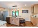 Modern kitchen featuring stainless steel appliances, granite countertops, and an island with bar stool seating at 126 N Darlington St, Jamestown, IN 46147
