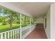 Inviting front porch with a classic swing, perfect for relaxing and enjoying the outdoor scenery at 126 N Darlington St, Jamestown, IN 46147