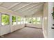 Sunroom with large windows, a white ceiling, and neutral carpet at 126 N Darlington St, Jamestown, IN 46147