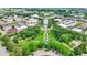 Overhead view of a beautiful community square and green spaces surrounded by well-maintained homes and businesses at 12999 Deerstyne Green St, Carmel, IN 46032