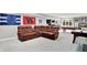 Finished basement with a large leather sectional, sports memorabilia, pool table, and wet bar at 12999 Deerstyne Green St, Carmel, IN 46032
