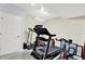 Home gym featuring a treadmill, elliptical, and other exercise equipment at 12999 Deerstyne Green St, Carmel, IN 46032