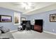 Office or bedroom with blue walls, neutral carpet, a fan, and a window at 12999 Deerstyne Green St, Carmel, IN 46032