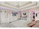 Cozy bedroom with a trey ceiling, plush carpet, and neutral decor at 12999 Deerstyne Green St, Carmel, IN 46032