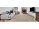 Bonus room features a comfortable seating area, desk, and large windows at 12999 Deerstyne Green St, Carmel, IN 46032