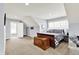 Bright bonus room includes bedroom area, seating area, and windows for light at 12999 Deerstyne Green St, Carmel, IN 46032