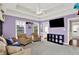 Cozy bonus room with plush carpeting, a ceiling fan, and views of the outdoors at 12999 Deerstyne Green St, Carmel, IN 46032