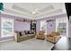 Comfortable bonus room with plush carpeting, a ceiling fan, and lots of light at 12999 Deerstyne Green St, Carmel, IN 46032