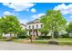 Beautiful two-story home featuring a lovely front yard with mature trees and well-maintained landscaping at 12999 Deerstyne Green St, Carmel, IN 46032