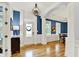 Elegant foyer with hardwood floors, stylish lighting, and decorative accents create a warm welcome at 12999 Deerstyne Green St, Carmel, IN 46032