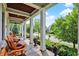 Charming front porch featuring comfortable seating, floral accents, and a view of the neighborhood street at 12999 Deerstyne Green St, Carmel, IN 46032