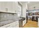 Well-appointed kitchen with stainless steel appliances, granite countertops, and a dining area at 12999 Deerstyne Green St, Carmel, IN 46032