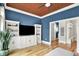 Beautiful living room with hardwood floors, and plenty of storage with custom built-ins for display and storage at 12999 Deerstyne Green St, Carmel, IN 46032