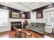 Cozy living room with a piano, comfortable seating, and natural light, perfect for relaxation at 12999 Deerstyne Green St, Carmel, IN 46032