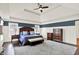 A generously sized bedroom offers a comfortable retreat with stylish furniture and tasteful decorations at 12999 Deerstyne Green St, Carmel, IN 46032